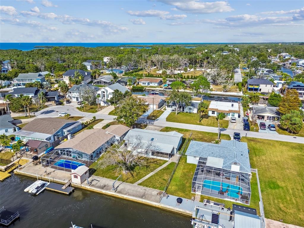 5410 Quist Drive Port Richey, FL 34668 - Photo 65 of 99 an aerial view of residential houses with outdoor space and swimming pool