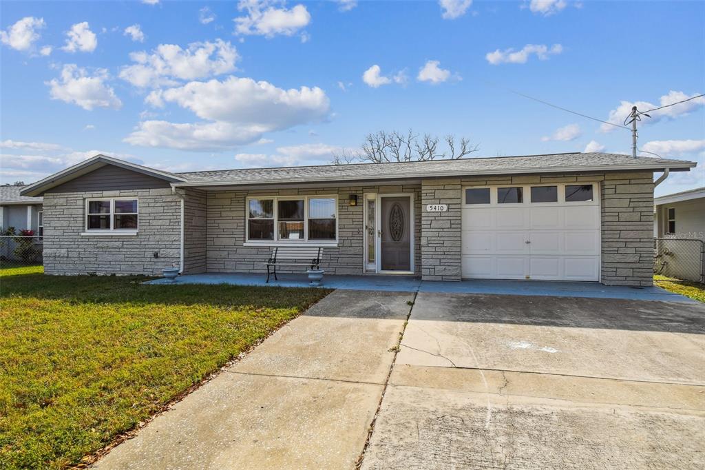 5410 Quist Drive Port Richey, FL 34668 - Photo 8 of 99 a view of a house with swimming pool in front of it