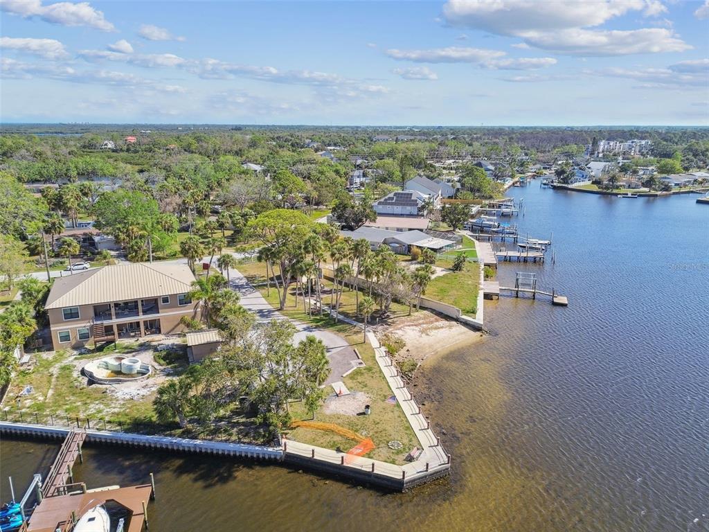 5410 Quist Drive Port Richey, FL 34668 - Photo 83 of 99 an aerial view of residential houses with outdoor space and lake view in back