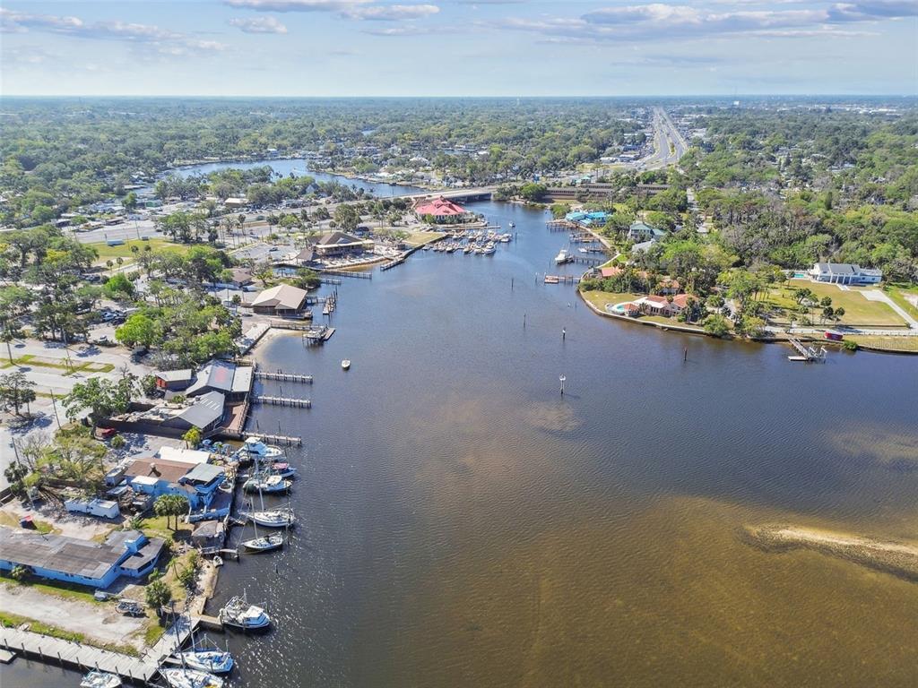 5410 Quist Drive Port Richey, FL 34668 - Photo 93 of 99 an aerial view of a house with a lake view
