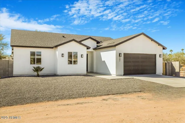 a front view of a house with a garage