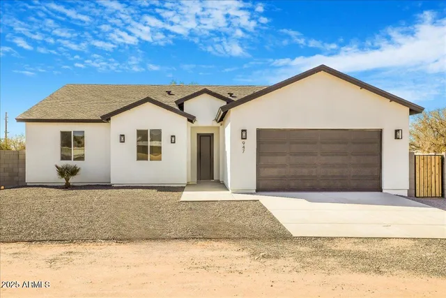 a front view of a house with a garage