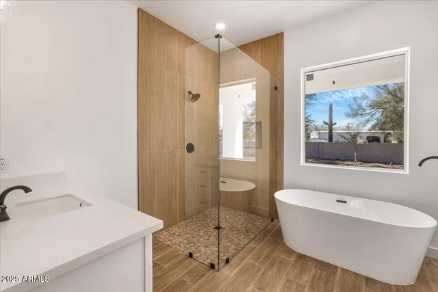 a bathroom with a bathtub and a sink