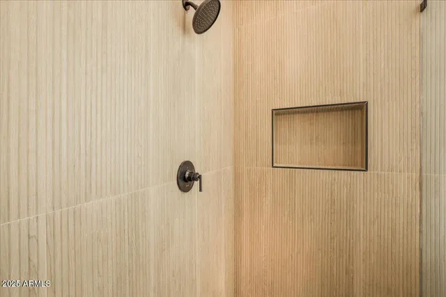 a kitchen with stainless steel appliances granite countertop a stove a sink dishwasher and a refrigerator with wooden floor