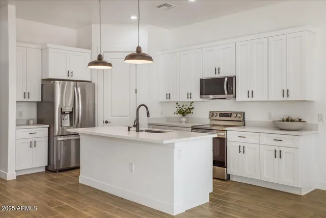 a view of a kitchen with a sink