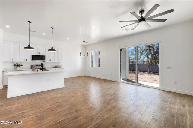 a view of kitchen view with wooden floor and window