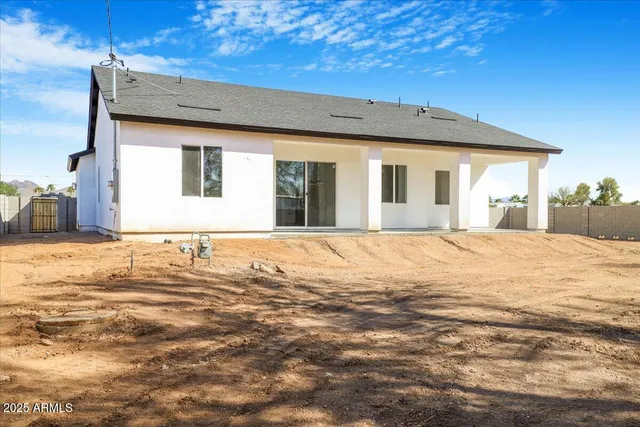a view of a house with a snow on the road