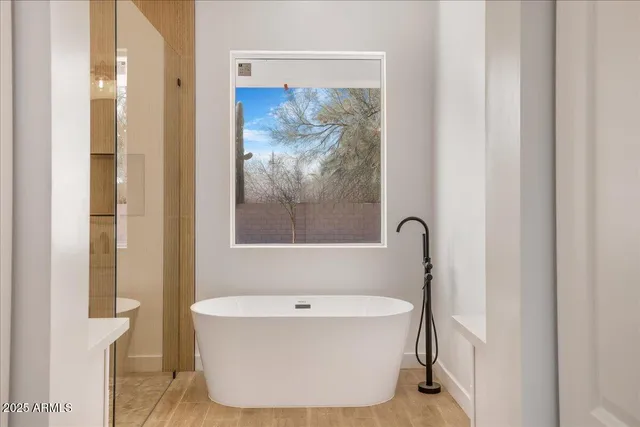 a bathroom with a sink mirror vanity and a vanity