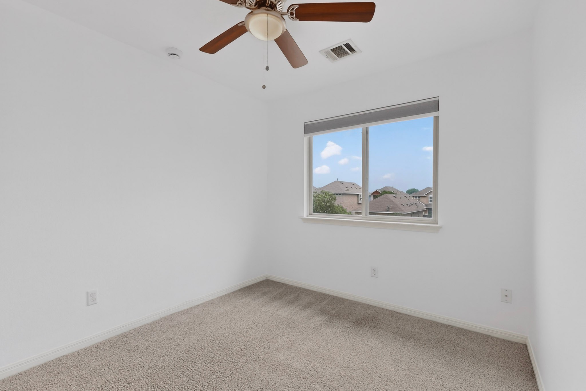 4619 Inicio Lane Austin, TX 78725 - Photo 21 of 32 an empty room with a window