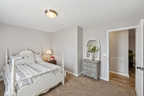 a bedroom with a bed and a cabinets