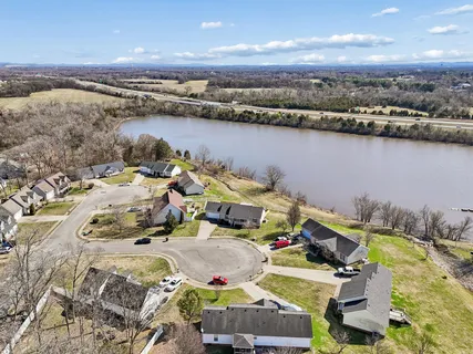 an aerial view of a house with a ocean view