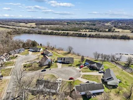 an aerial view of a house with a ocean view