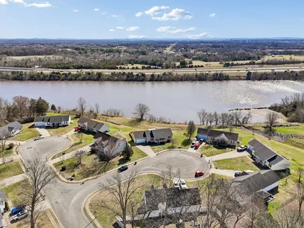 an aerial view of a house with outdoor space