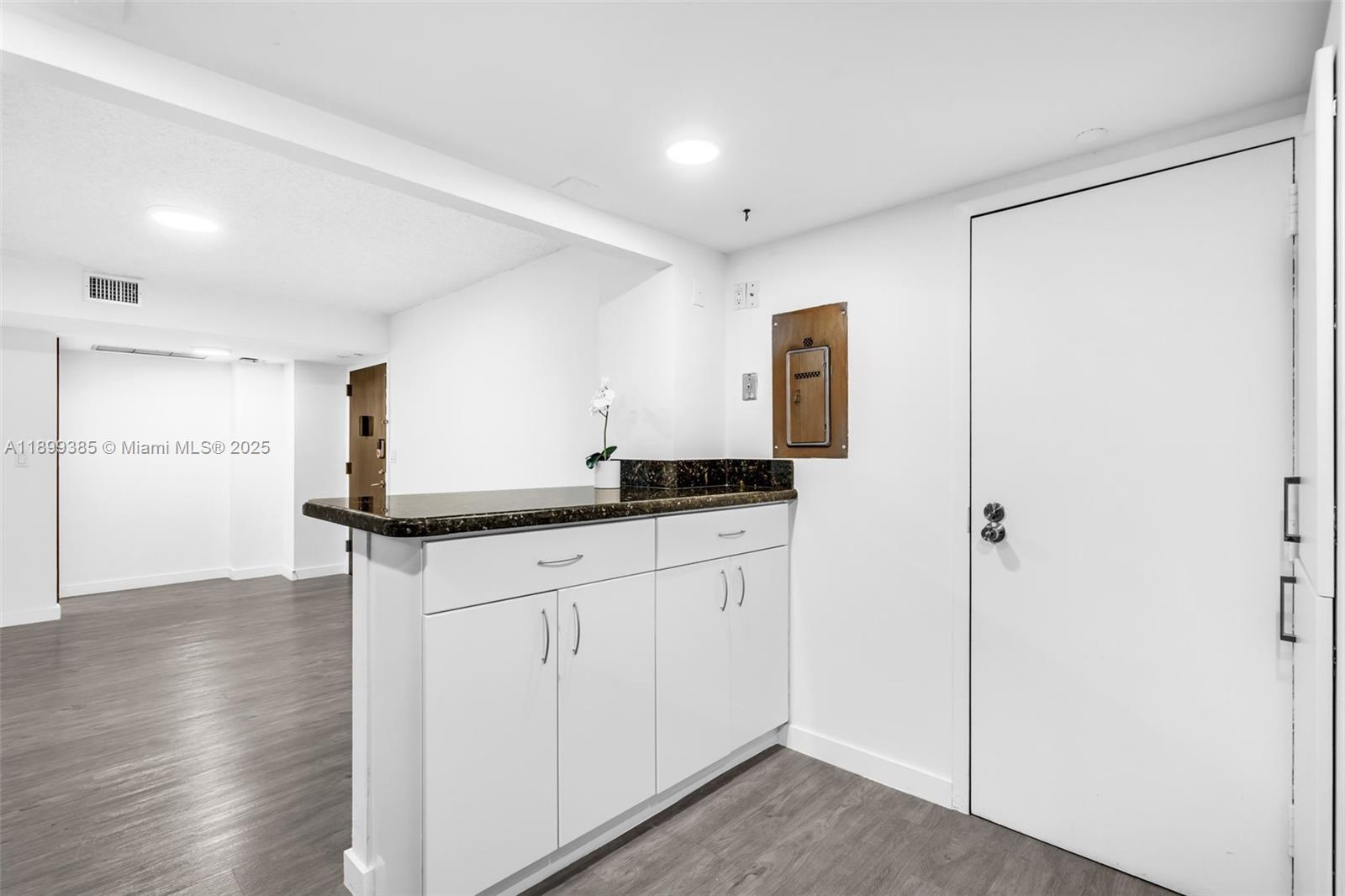 2333 Brickell Avenue, Unit PH208 Miami, FL 33129 - Photo 15 of 40 a kitchen with a sink and refrigerator