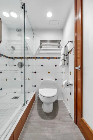 a bathroom with a toilet sink and shower