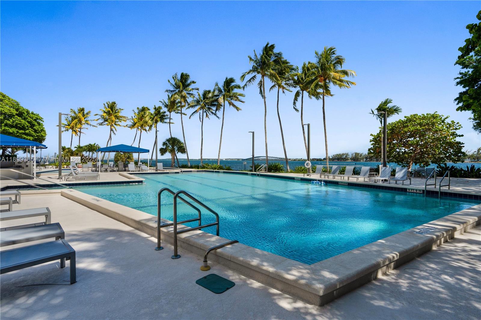 2333 Brickell Avenue, Unit PH208 Miami, FL 33129 - Photo 26 of 40 a view of swimming pool with outdoor seating and lake view