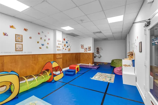 a living room with furniture and fish tank
