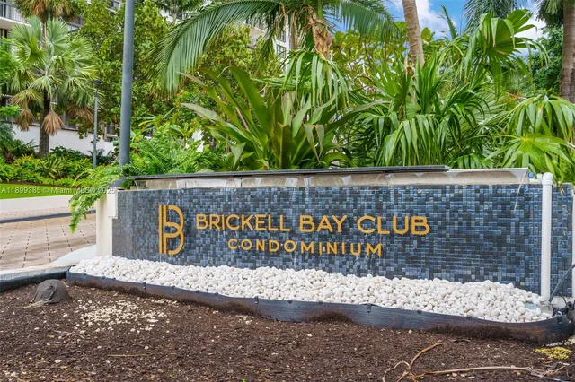 a wooden sign on the side of a building