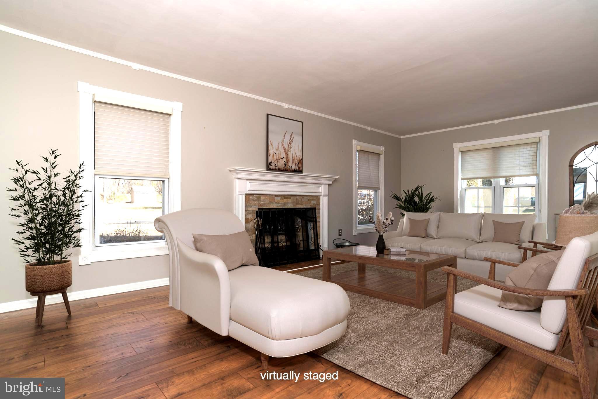 29 Trim Road Levittown, PA 19056 - Photo 2 of 32 a living room with furniture and a fireplace