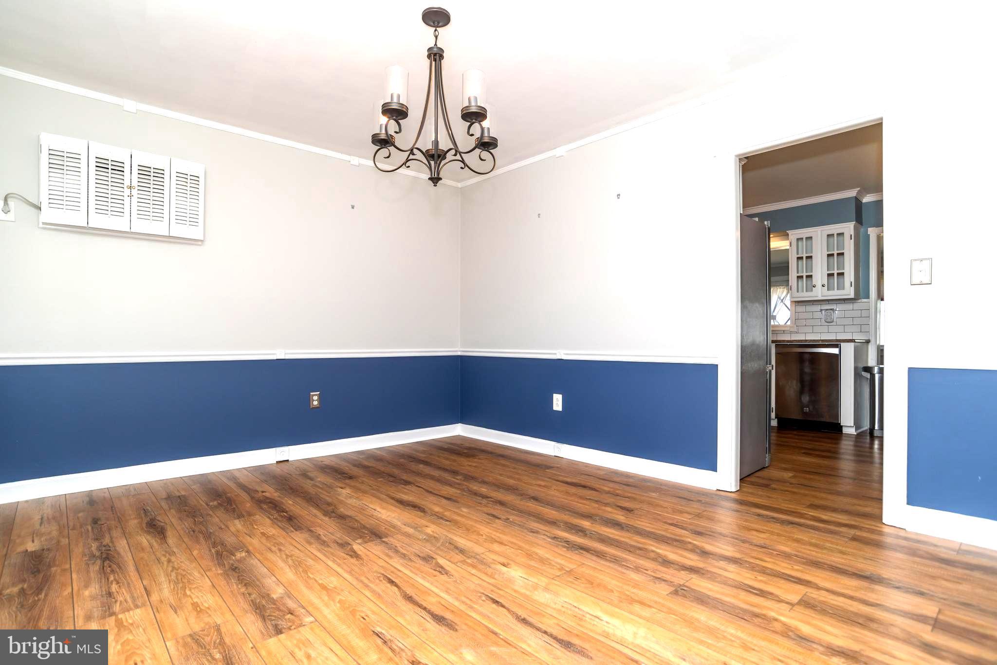 29 Trim Road Levittown, PA 19056 - Photo 5 of 32 a view of a room with a chandelier and wooden floor