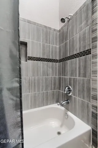 a bathroom with a sink and a shower