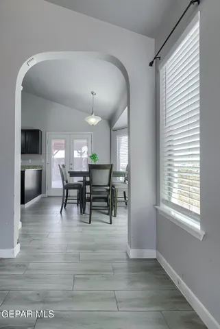 a view of a dining room with furniture and window