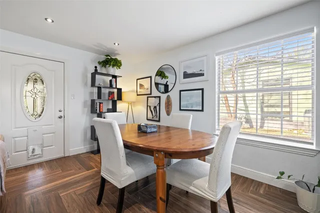 a view of a dining room with furniture window and wooden floor