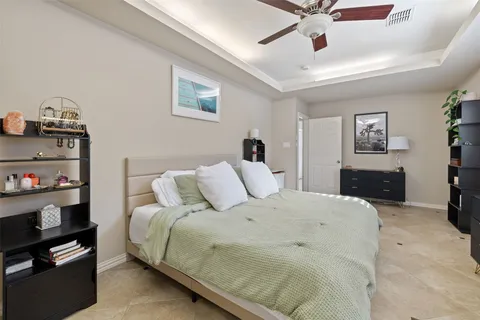 a bedroom with a bed and dresser