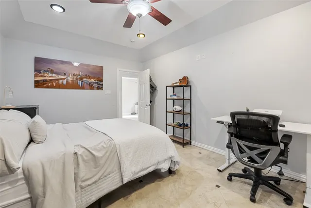 a bedroom with a bed and a bookshelf