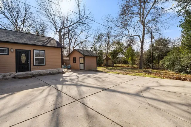 a house with trees in front of it