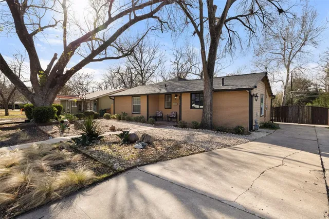 a front view of a house with outdoor seating