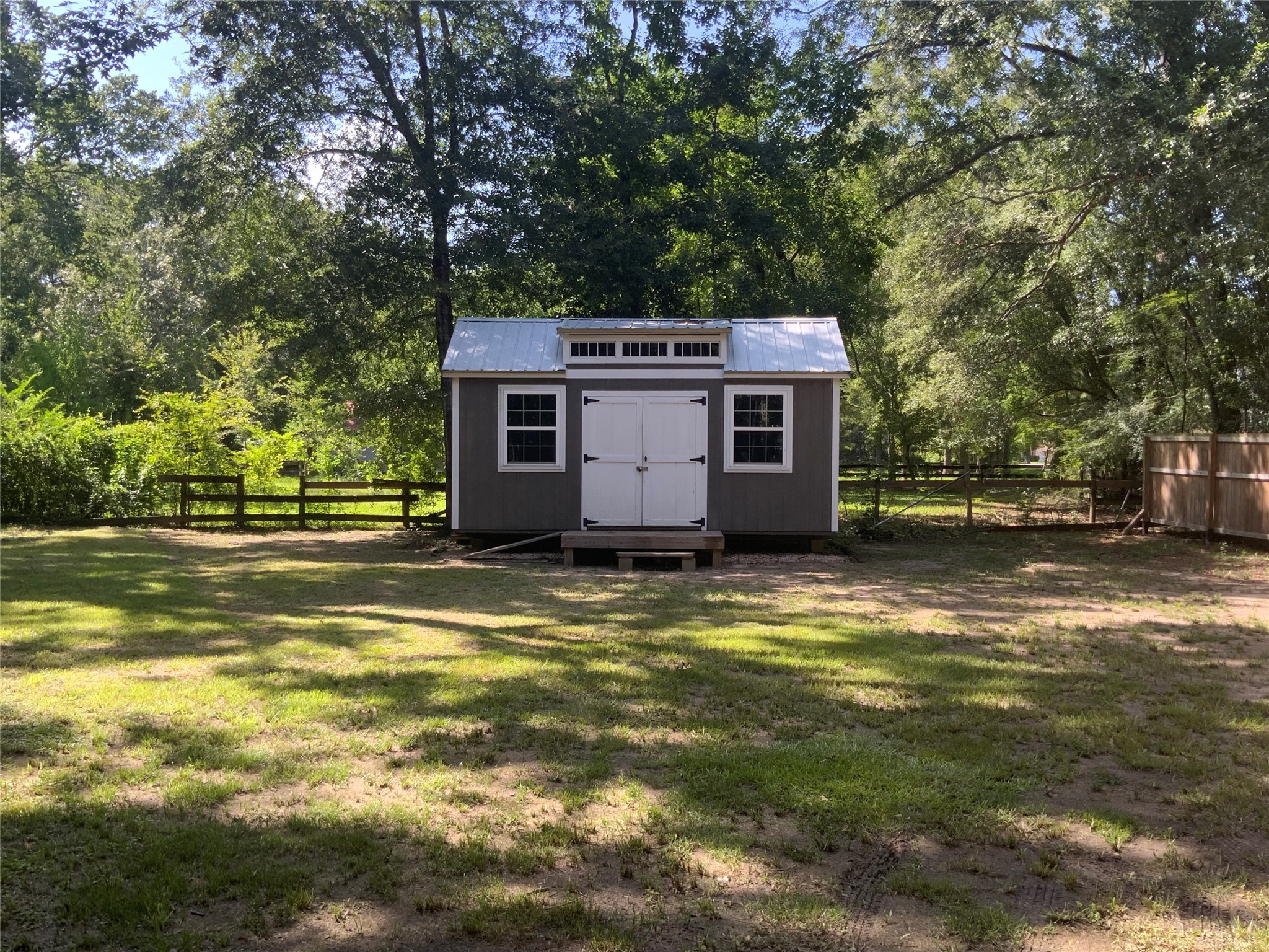 1114 Lake Glen Road Huffman, TX 77336 - Photo 1 of 22 a view of a house with a swimming pool