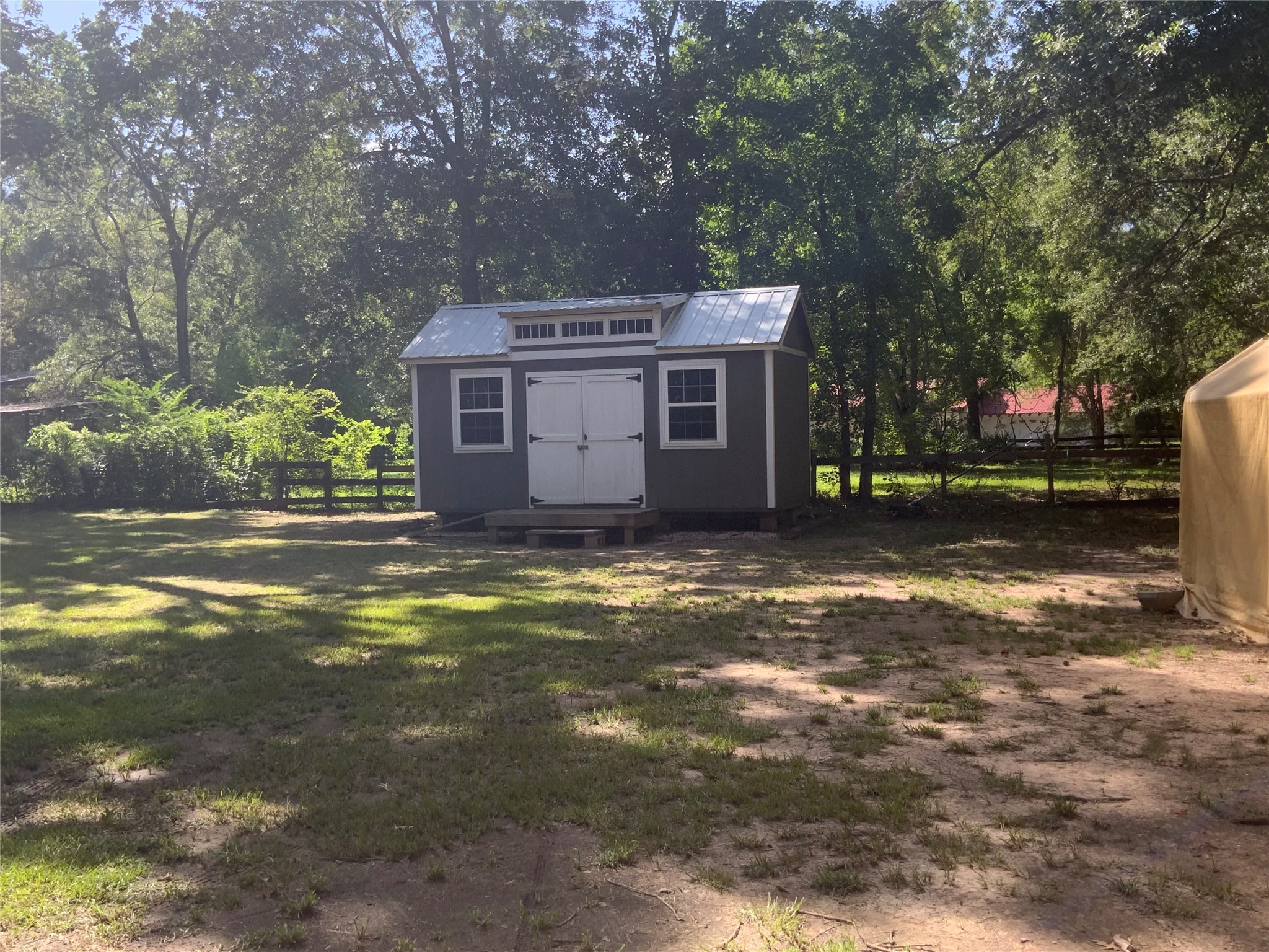1114 Lake Glen Road Huffman, TX 77336 - Photo 22 of 22 a view of a house with a yard