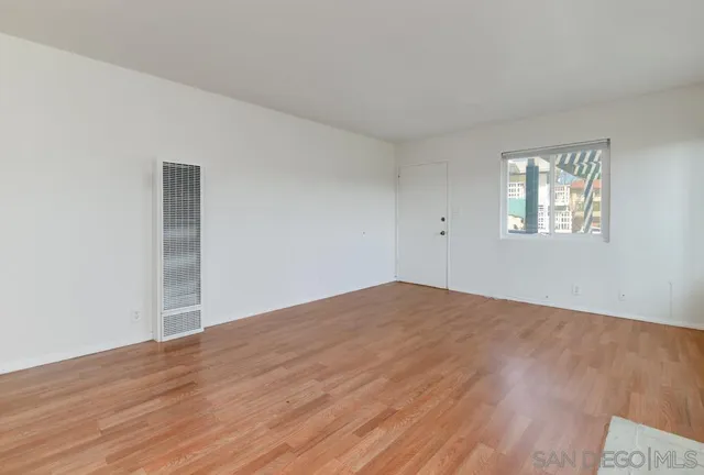 a kitchen with a refrigerator and a stove top oven