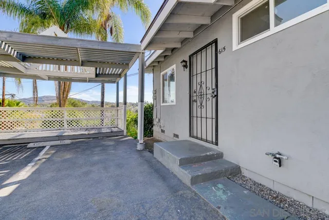 a view of a porch with wooden floor and fence
