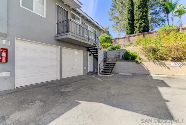 a view of a chairs and table in the patio