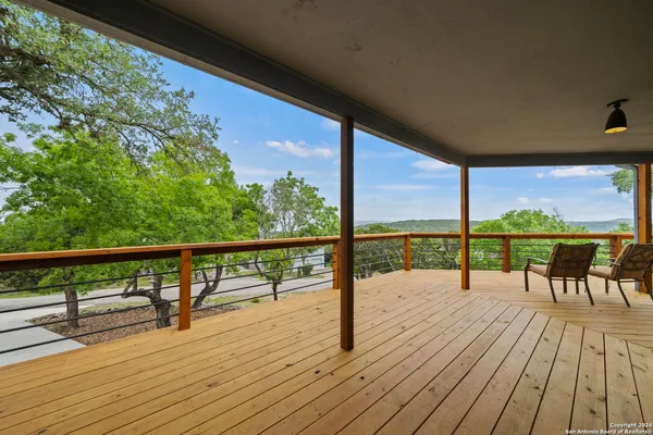 a view of balcony with wooden floor