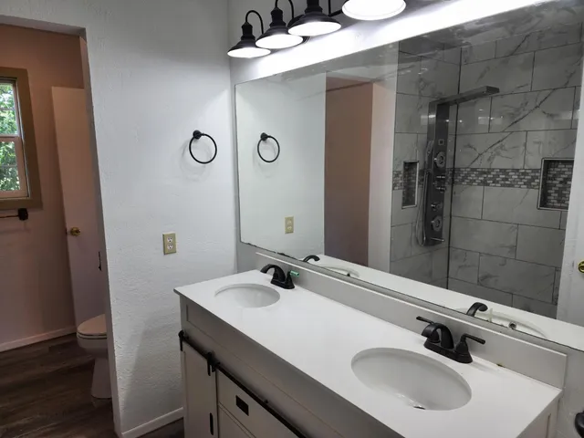 a bathroom with a sink and a mirror