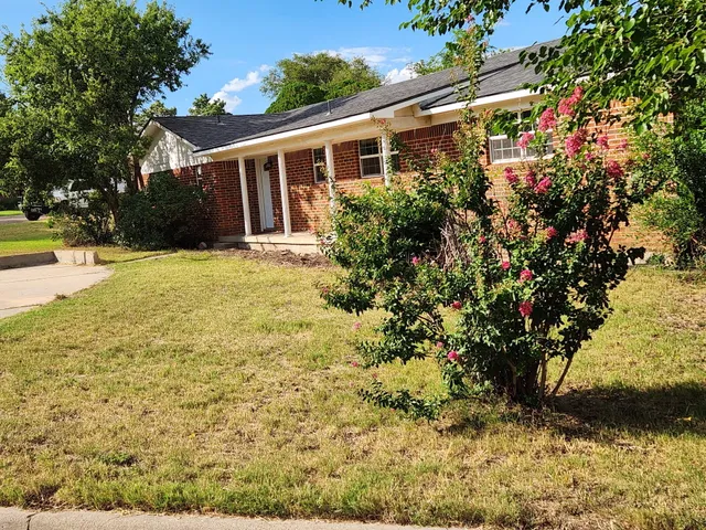 a front view of house with yard