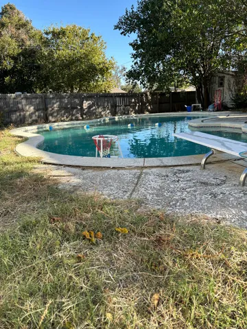 a view of a fountain in front of a house