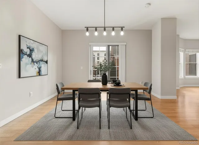 a view of a dining room with furniture window and wooden floor