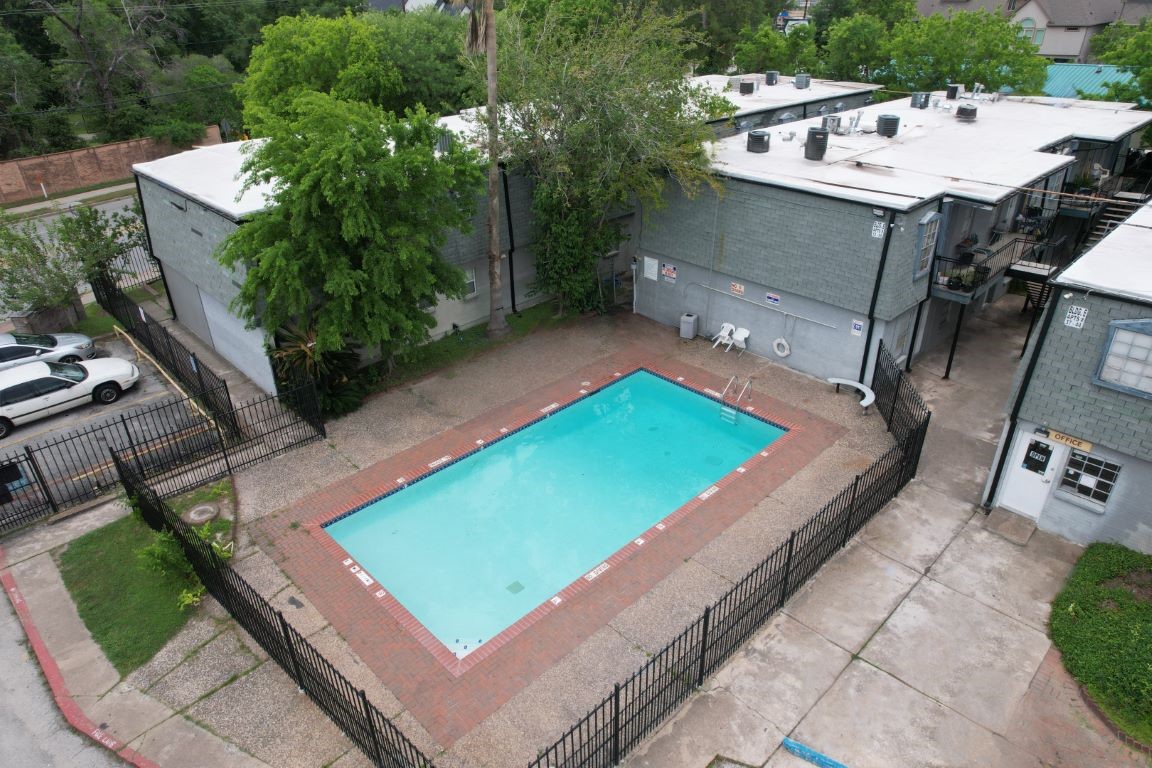 9745 Long Point Road, Unit 30 Houston, TX 77055 - Photo 5 of 7 a view of a pool with a yard