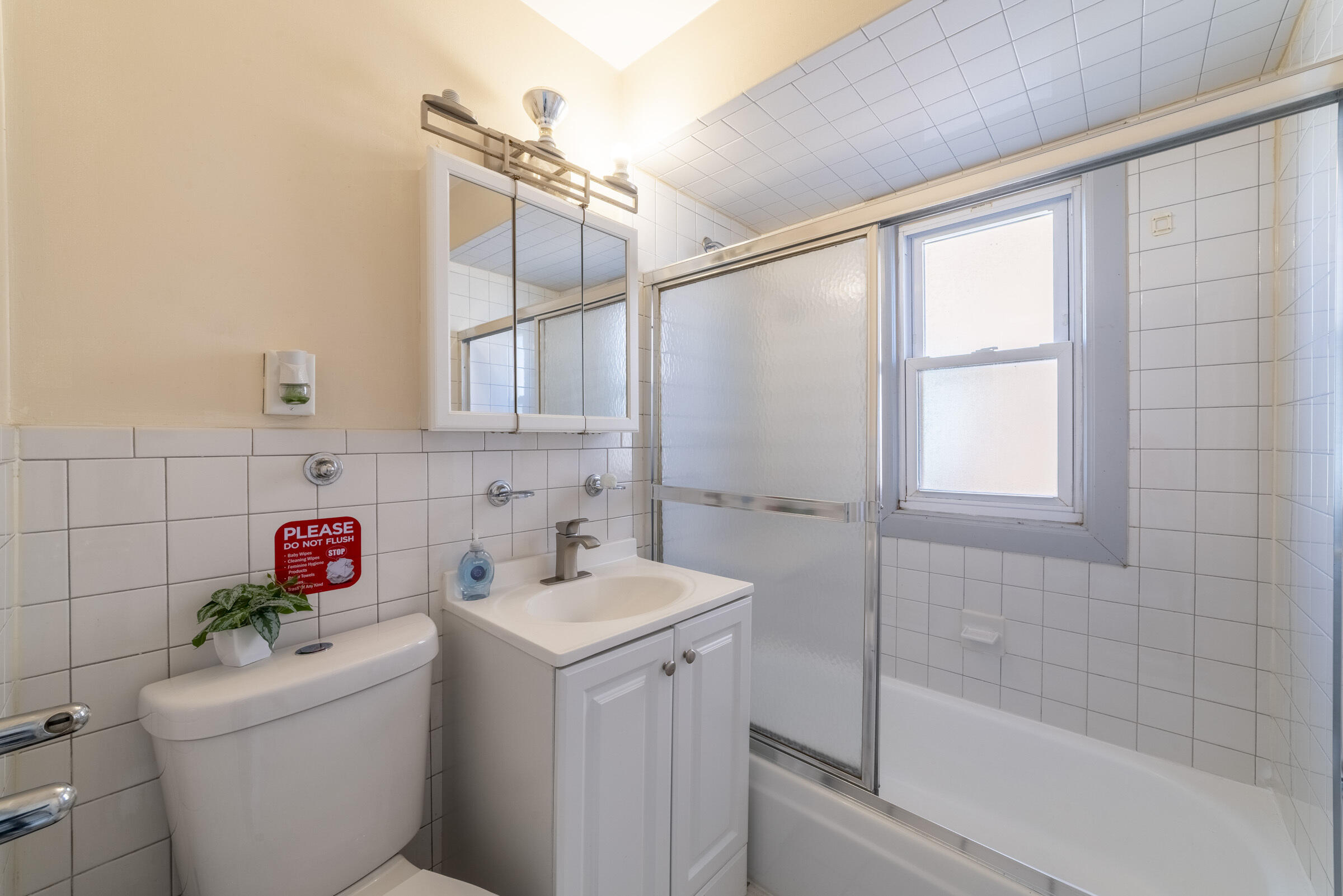 314 Cleveland Street Gary, IN 46404 - Photo 23 of 60 a bathroom with a sink a toilet and shower