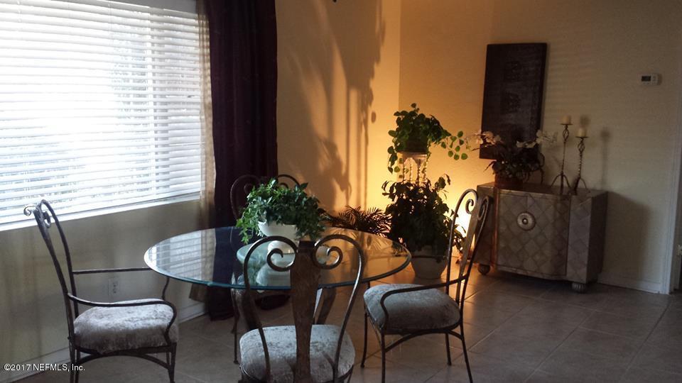 2733 Rainbow Road Jacksonville, FL 32217 - Photo 6 of 16 a view of a livingroom with furniture and a potted plant