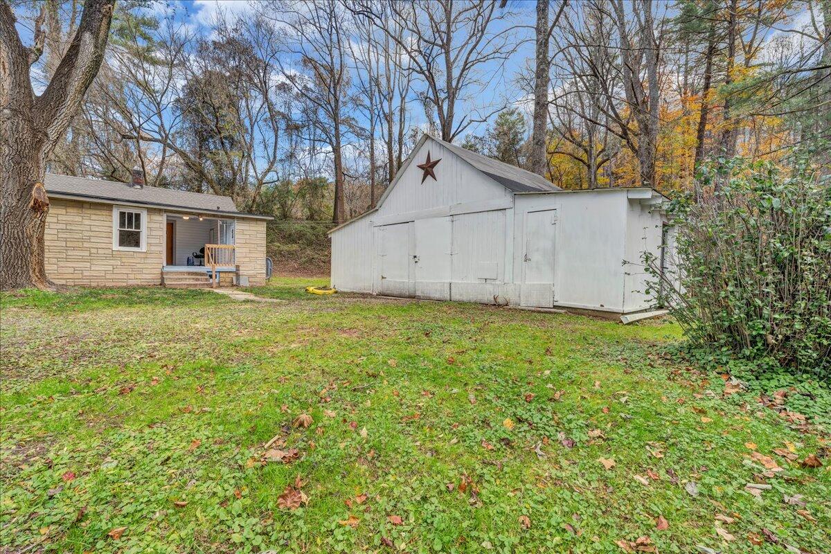6364 Franklin Road Boones Mill, VA 24065 - Photo 22 of 24 a view of a backyard with large trees