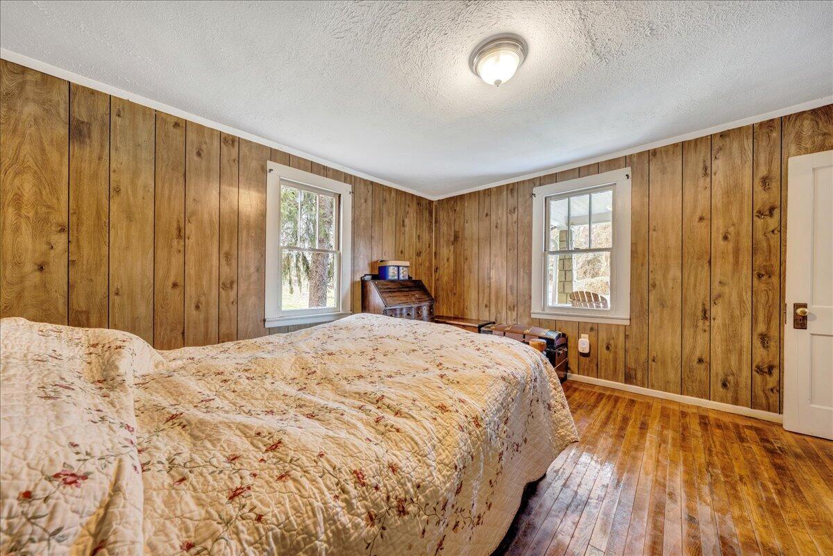 6364 Franklin Road Boones Mill, VA 24065 - Photo 8 of 24 a bedroom with a bed and a dresser