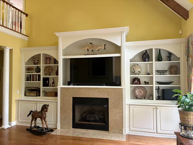 a view of a livingroom with furniture and a fireplace