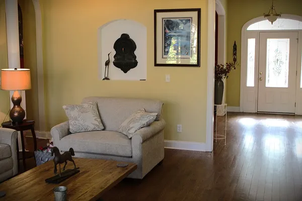 a living room with furniture and a window