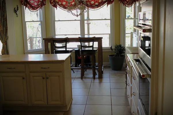 a kitchen with cabinets and window
