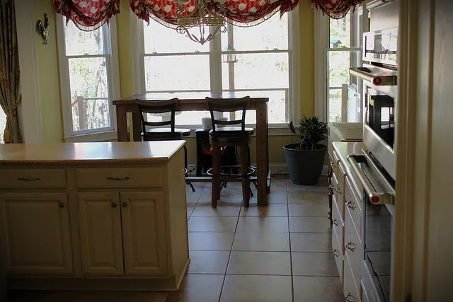 a kitchen with cabinets and window